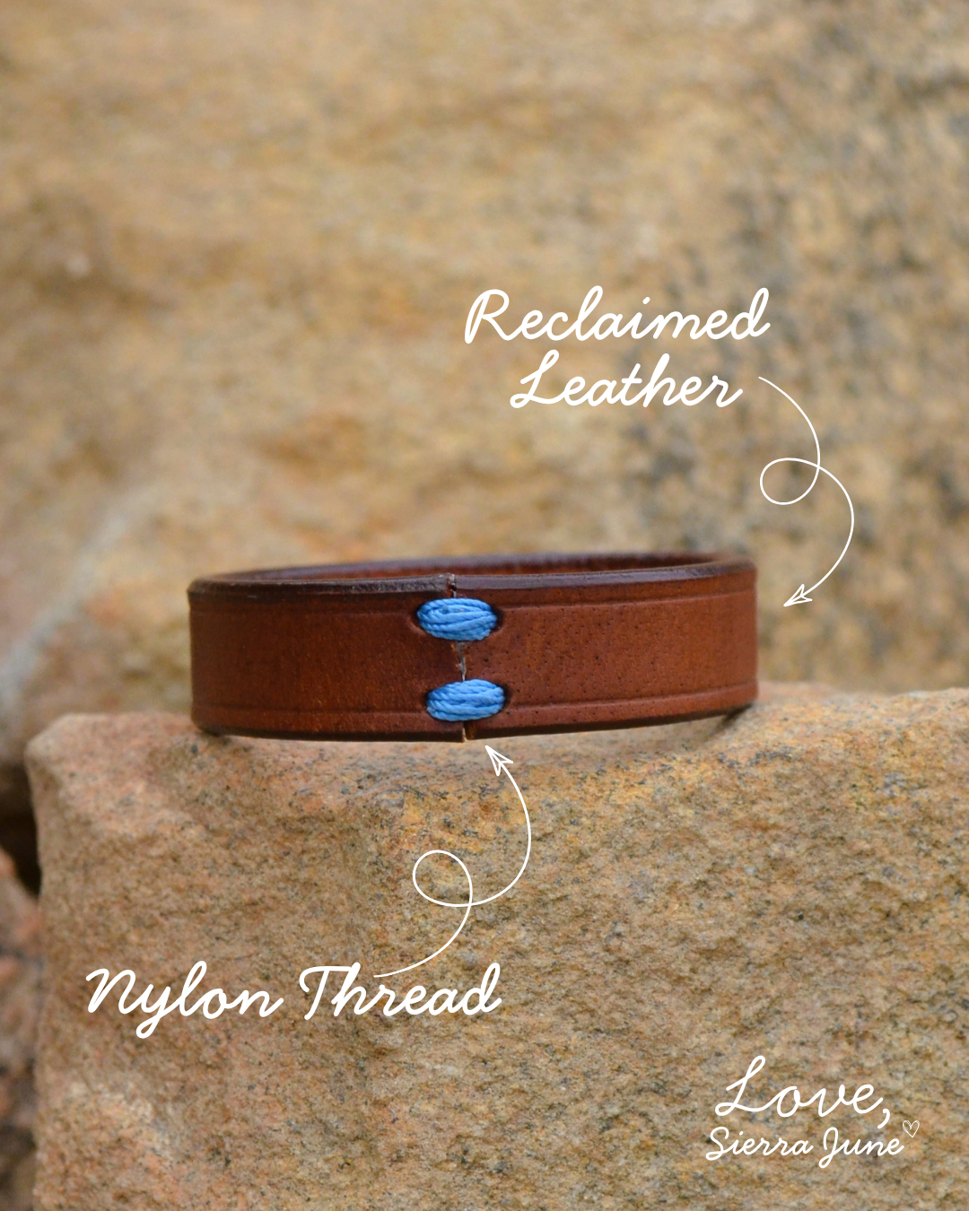 A brown leather cuff bracelet with blue nylon stitching and white text overlays pointing to 'Reclaimed Leather' and 'Nylon Thread', set against a natural rock background.